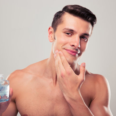 a man applying face cream